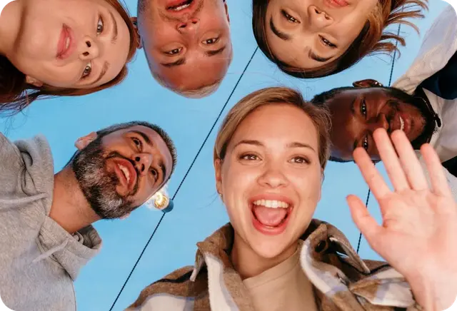 group of people smiling for a camera